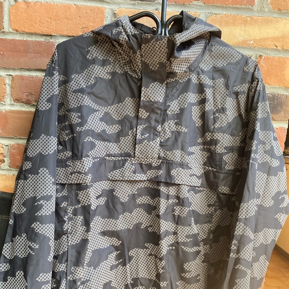 Fully reflective sporty poncho style jacket